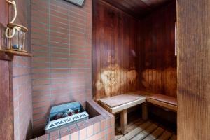 a bathroom with a sauna with a bench at Few Days Condominium 205 in Jozankei