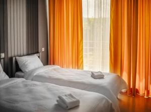 מיטה או מיטות בחדר ב-Chateau Tsinandali Hotel
