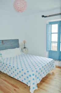 Ein Bett oder Betten in einem Zimmer der Unterkunft Casa Mosaico Granada en el V de Lecrin