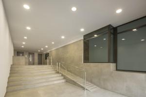 a staircase in a building with a large window at Macflats Ciudad de las Ciencias in Valencia