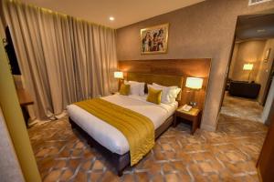 מיטה או מיטות בחדר ב-LE PALME HOTEL