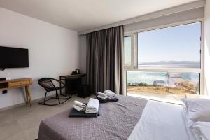 TV a/nebo společenská místnost v ubytování Areti Hotel + 32 fotografií