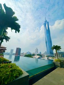 a view of the burj khalifa and the city at Millennium Suite At Opus Residence in Kuala Lumpur