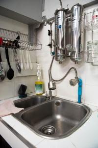 a kitchen sink with a faucet on a counter at Chill @ Phetchaburi in Phetchaburi