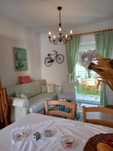 a living room with a table and a couch at Siviri kassandras Xalkidiki, Experience Accomodation in Siviri