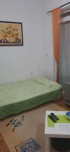 Postel nebo postele na pokoji v ubytování Apartman studio DUE