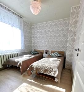 Postel nebo postele na pokoji v ubytování Põltsamaa city apartement