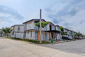 a row of houses on the side of a street at OYO Life 92719 Rolling Hills Residence Karawang in Karawang