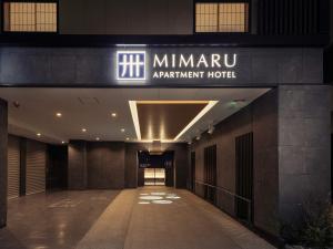 a building with a sign that reads minivan apartment hotel at MIMARU TOKYO HATCHOBORI in Tokyo