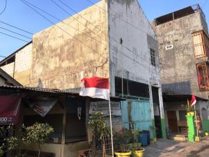 a flag flying in front of a building at OYO Life 93009 Griya Nautika Sedati in Sidoarjo