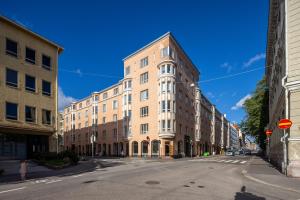 an empty city street with a large building at Comfortable city home in Helsinki