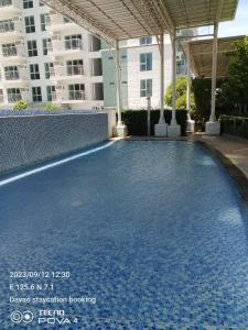 a swimming pool in the middle of a building at Abreeza place T-2 in Davao City +5 photos