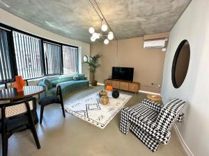 a living room with a couch and a table at HOFT Cihangir in Istanbul