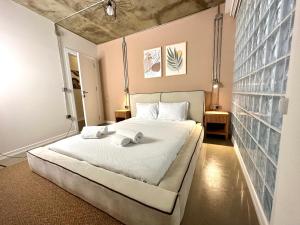 a bedroom with a bed with two towels on it at HOFT Cihangir in Istanbul