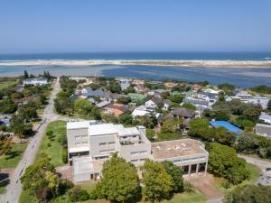 an aerial view of a house with the ocean in the background at Manhattan Estates - Plettenberg Bay in Plettenberg Bay