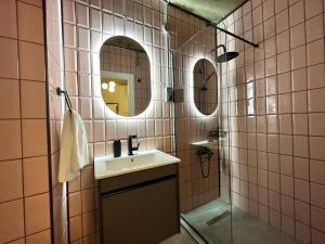 a bathroom with a sink and a mirror at HOFT Cihangir in Istanbul +84 photos