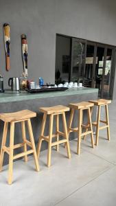 three wooden picnic tables in front of a counter at Tomo Safari Lodge in Hoedspruit