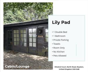 a large log cabin with a sliding door at Lily Pad by Paymán Club in Royston
