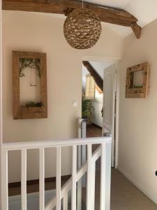 a hallway with white railings and a ceiling at Gîte la belle etoile proche de Granville in Ver +23 photos