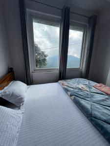 Postel nebo postele na pokoji v ubytování Pratha Homestay