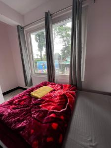 Postel nebo postele na pokoji v ubytování Pratha Homestay