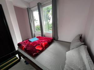 Postel nebo postele na pokoji v ubytování Pratha Homestay