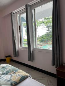 Postel nebo postele na pokoji v ubytování Pratha Homestay