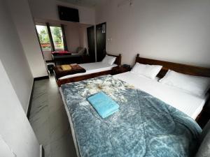Postel nebo postele na pokoji v ubytování Pratha Homestay