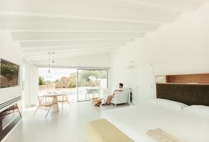A television and/or entertainment centre at Cas Cabo Nou Agroturismo Adults Only