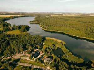 an aerial view of a house on a island in a river at Mięta in Wągrowiec