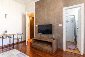 a living room with a flat screen tv on a wall at Ugi house - City Center in Belgrade