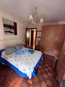 A bed or beds in a room at Apartamento Isabel