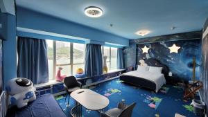 A bed or beds in a room at Grand Bay View Hotel