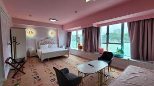 A bed or beds in a room at Grand Bay View Hotel