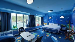 A bed or beds in a room at Grand Bay View Hotel