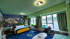 A bed or beds in a room at Grand Bay View Hotel