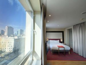 Posteľ alebo postele v izbe v ubytovaní Mercure Warszawa Grand