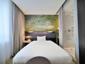 Posteľ alebo postele v izbe v ubytovaní Mercure Warszawa Grand
