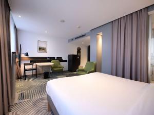 Posteľ alebo postele v izbe v ubytovaní Mercure Warszawa Grand