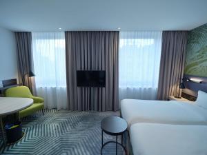 Posteľ alebo postele v izbe v ubytovaní Mercure Warszawa Grand
