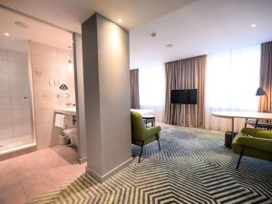 Posteľ alebo postele v izbe v ubytovaní Mercure Warszawa Grand