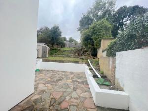 a view of a patio from the outside of a house at Beautifully refurbished 5-bed - Great Transport - Free Parking (sleeps 12) in London