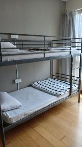 a group of bunk beds in a room at ARH Home KLCC in Kuala Lumpur