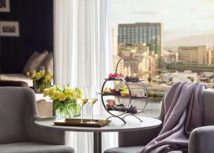 a table in a room with a view of a city at Anantara The Marker Dublin- A Leading Hotel of the World in Dublin