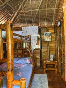 a room with two bunk beds and a chair at Hillcreek's Riverside Hideaway in Murcia