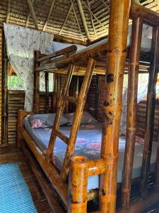 a bedroom with two bunk beds in a cabin at Hillcreek's Riverside Hideaway in Murcia