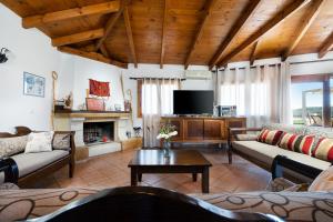 Televízia a/alebo spoločenská miestnosť v ubytovaní 4-bedroom Topolia House