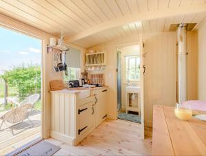 a kitchen with a counter and a table in a room at Hot Tub Retreat - Hartley Wine Estate 