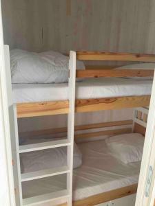 a couple of bunk beds in a room at Studio très lumineux 4 pers in Les Carroz d'Araches