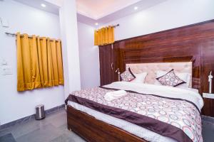 Postel nebo postele na pokoji v ubytování Golden Residency